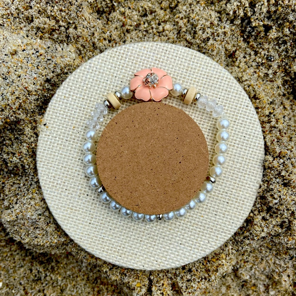 Hand made pearl bracelet with ladybug on a flower charm